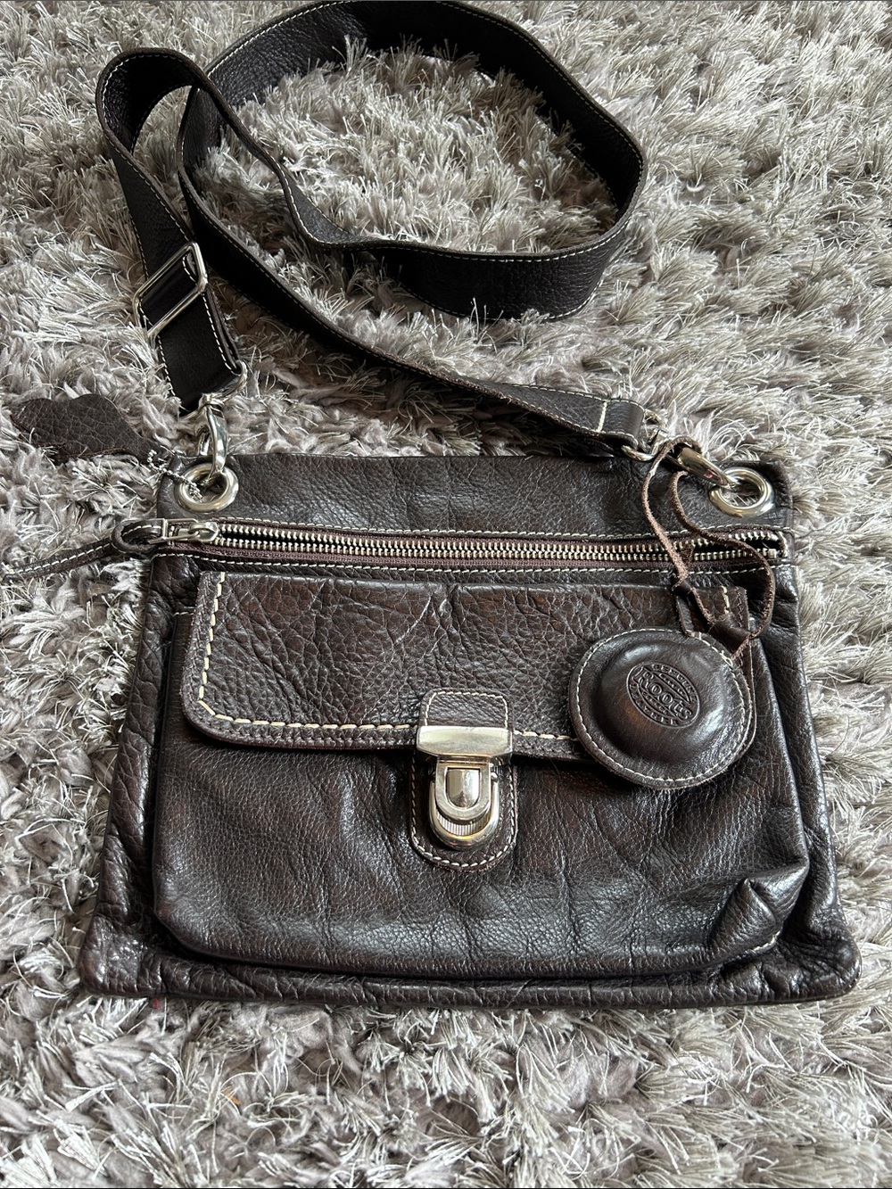 Roots Brown Leather Crossbody Bag with Brown Peace Charm